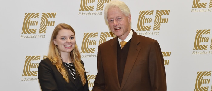 Master of International Marketing candidate, Kathrin Schulbe, shakes hands with the 42nd President of the United States, Bill Clinton, at EF Education First's 50th anniversary celebration
