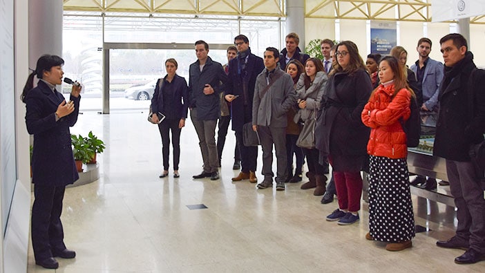 Students listening to the welcome speech at Volkswagen