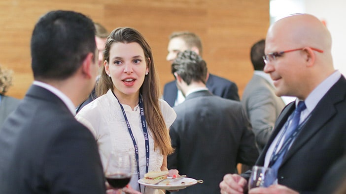 Students networking with hiring managers during Hult's Career Open House