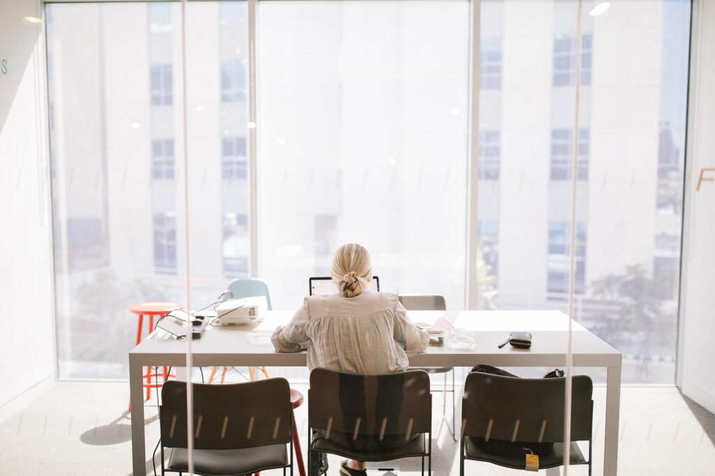 female student working on presentation in office